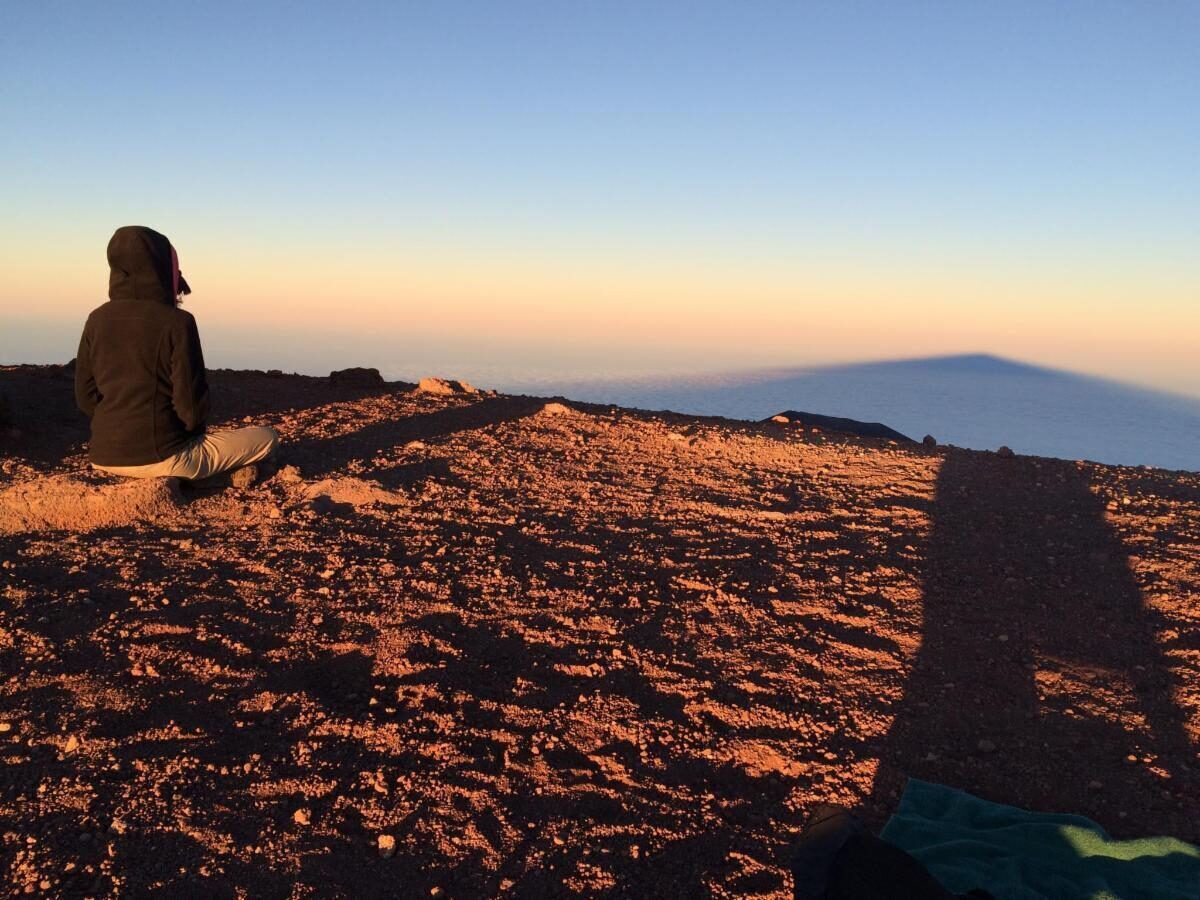 meditator on a hill top