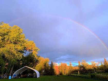Polestar pavilion with a rainbow overhead