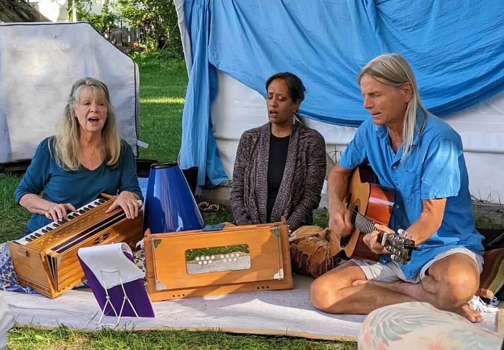 kirtan people playing instruments and singing